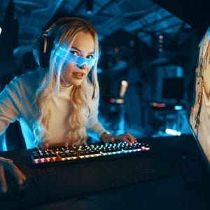 A blonde is playing PC games. Cyberpunk neon style.