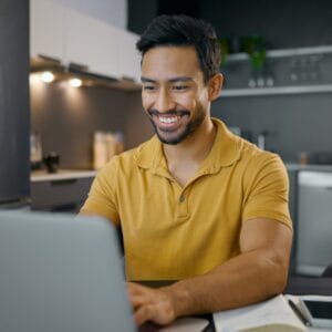 Man work from home, laptop and typing, copywriter writing article with internet research and smile